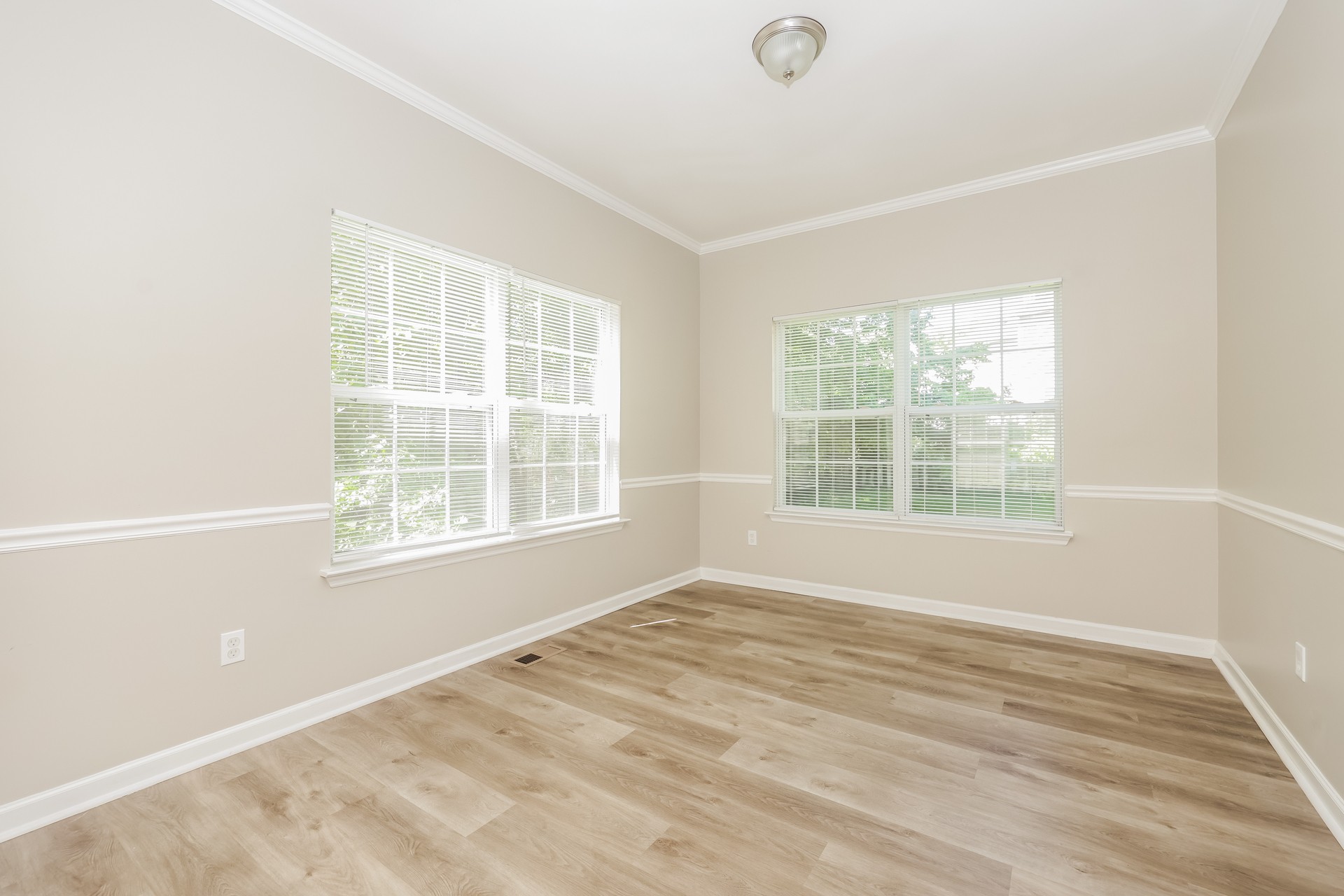 6104 Bentwood Drive Antioch, TN 37013 - Photo 4 of 17 an empty room with wooden floor and windows