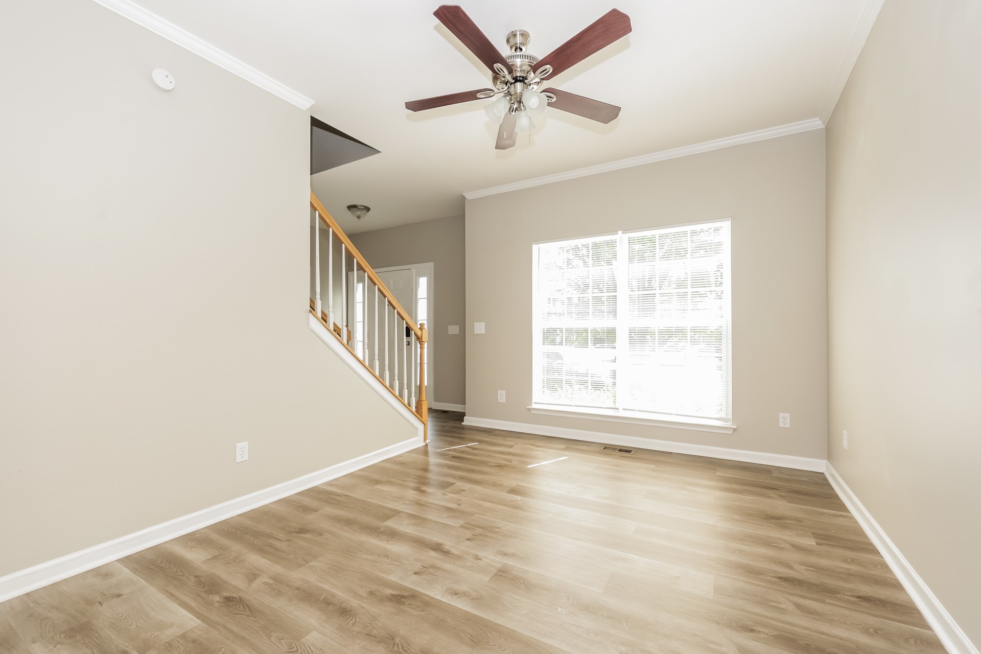 6104 Bentwood Drive Antioch, TN 37013 - Photo 5 of 17 a view of an empty room with wooden floor and a window