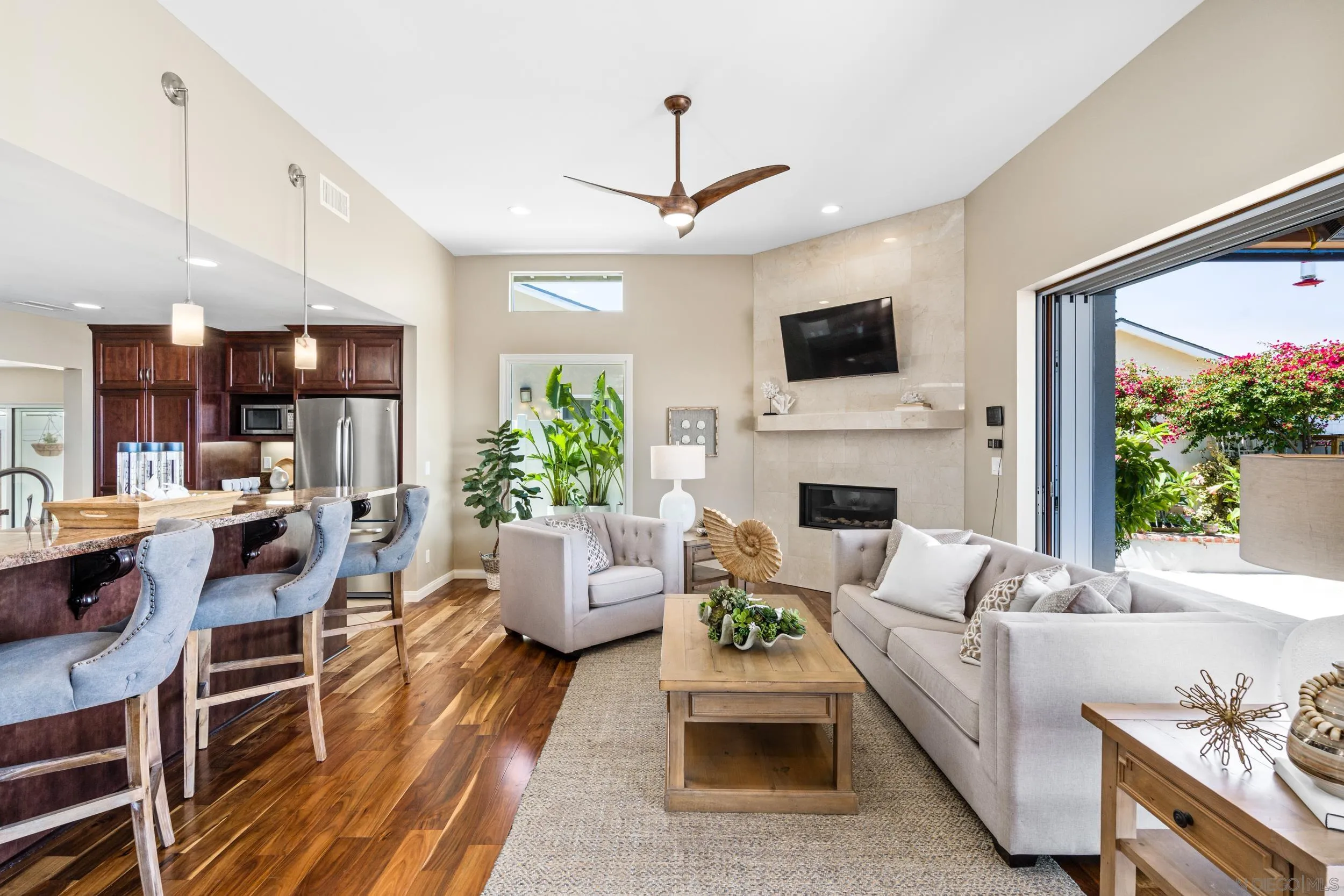 5785 Soledad Mountain Road La Jolla, CA 92037 - Photo 12 of 50 a living room with furniture fireplace and a flat screen tv