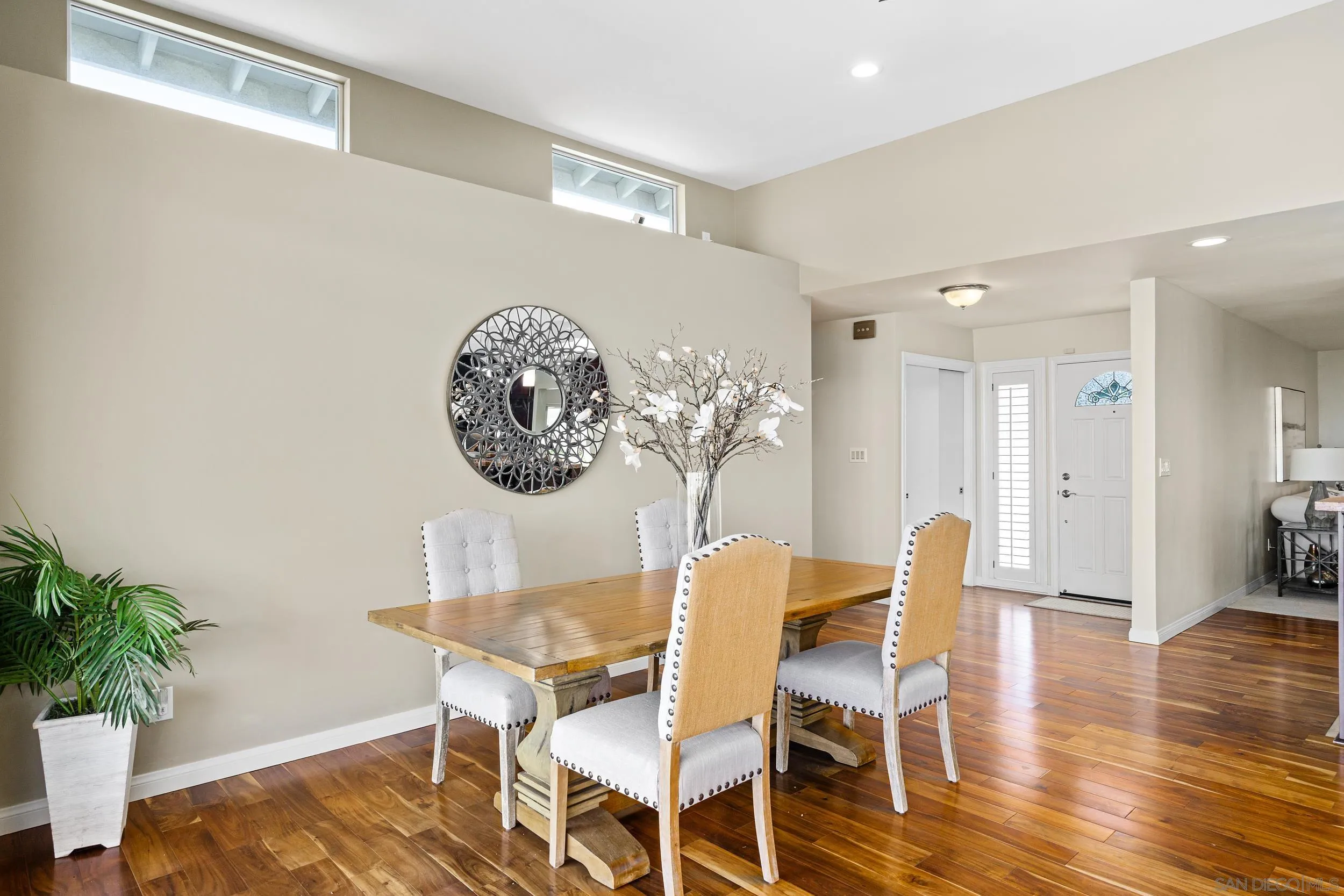 5785 Soledad Mountain Road La Jolla, CA 92037 - Photo 14 of 50 a dining room with furniture and wooden floor
