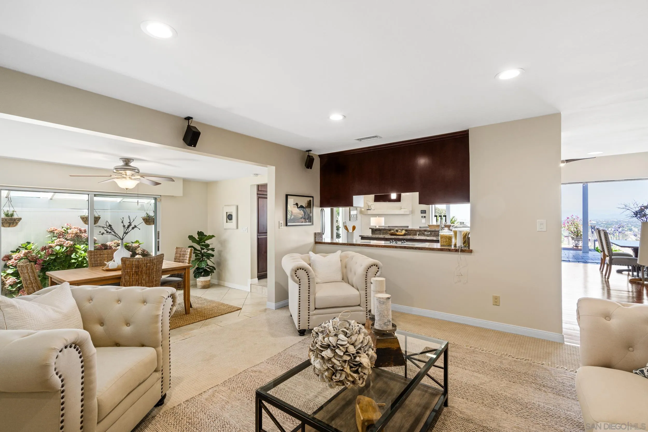 5785 Soledad Mountain Road La Jolla, CA 92037 - Photo 16 of 50 a living room with furniture and kitchen view