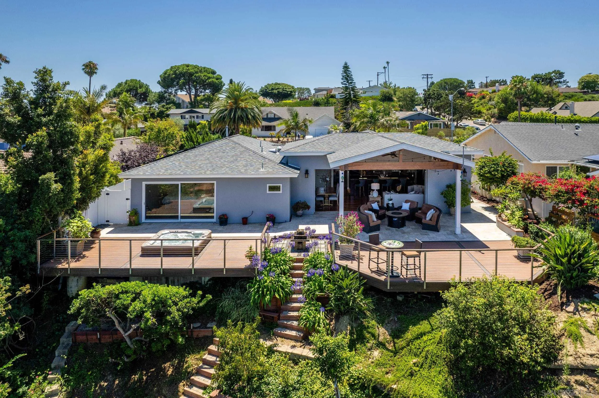 5785 Soledad Mountain Road La Jolla, CA 92037 - Photo 2 of 50 a front view of a house with garden and sitting area
