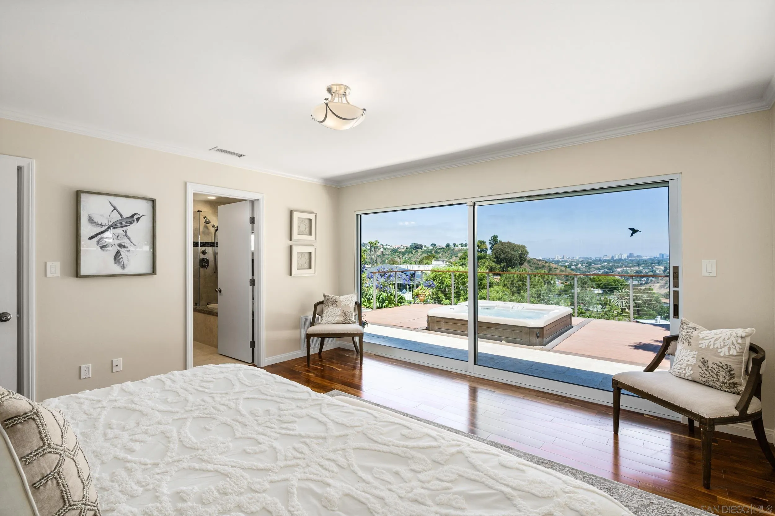 5785 Soledad Mountain Road La Jolla, CA 92037 - Photo 28 of 50 a bedroom with a bed and large window