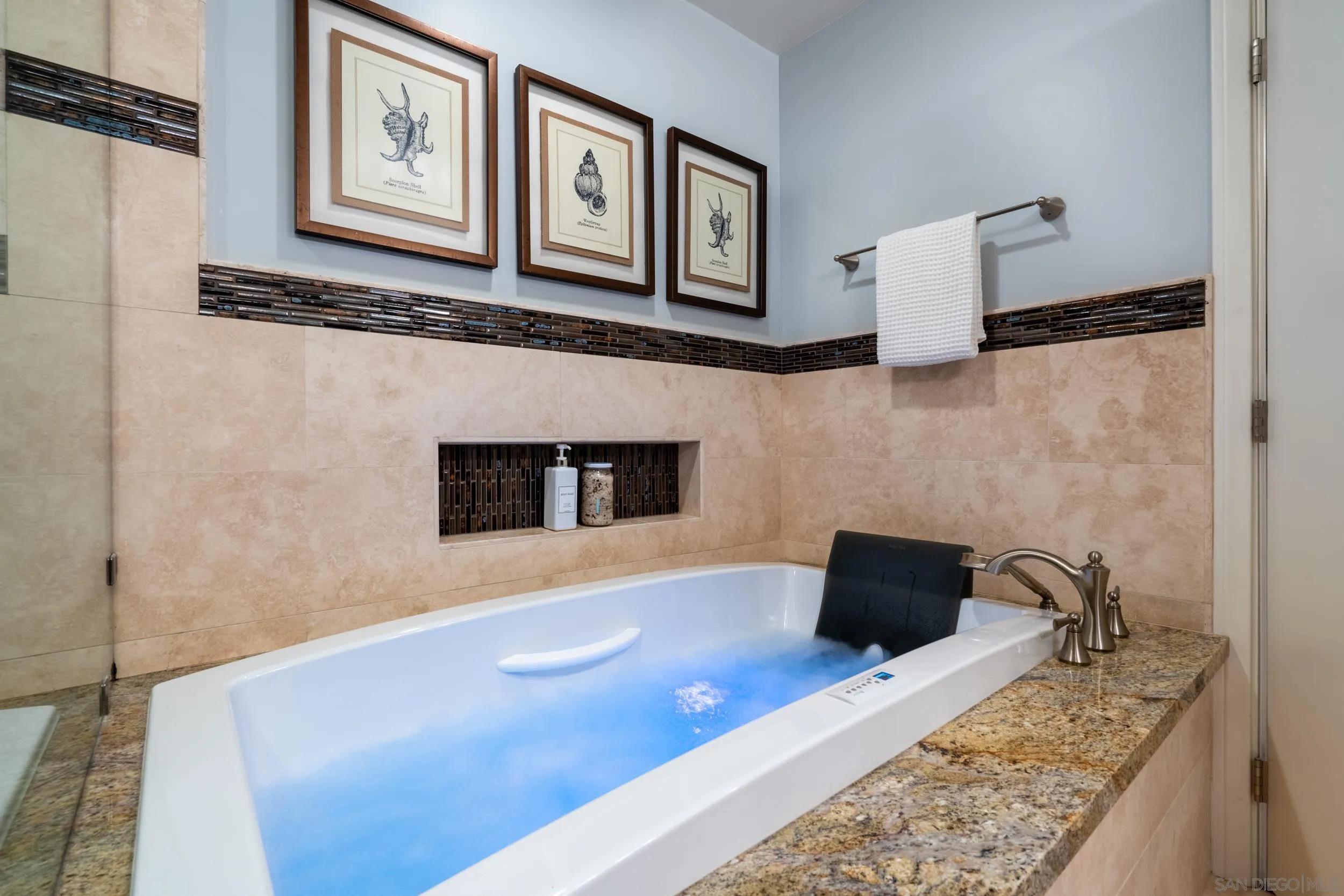 5785 Soledad Mountain Road La Jolla, CA 92037 - Photo 31 of 50 a living room with furniture and a flat screen tv