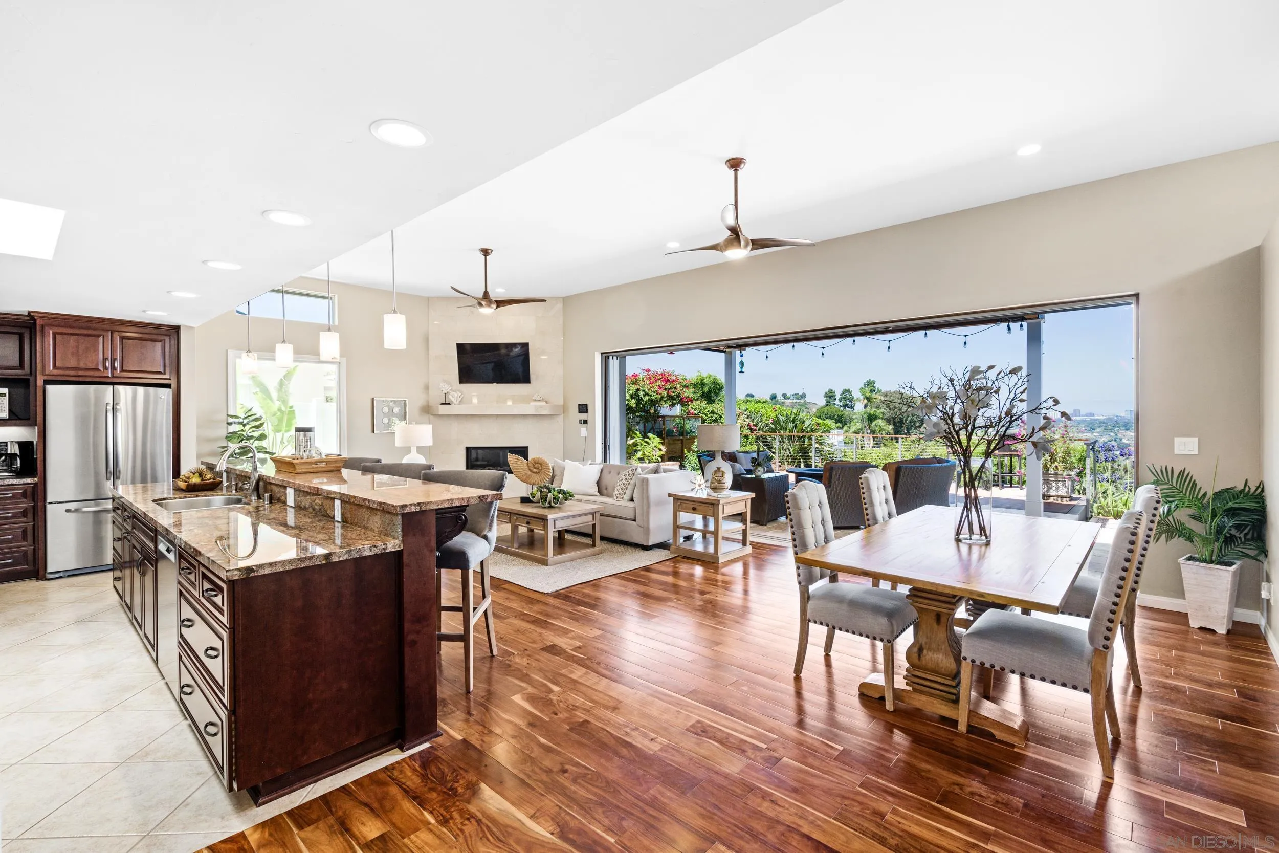 5785 Soledad Mountain Road La Jolla, CA 92037 - Photo 7 of 50 a view of a dining room with furniture window and wooden floor
