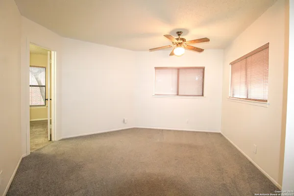 a view of an empty room with a window