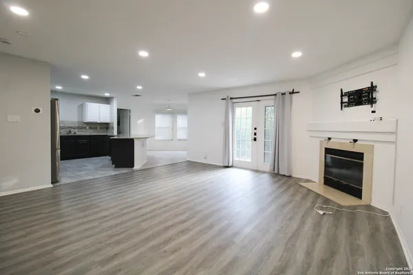 a view of a kitchen with a sink and a stove top oven