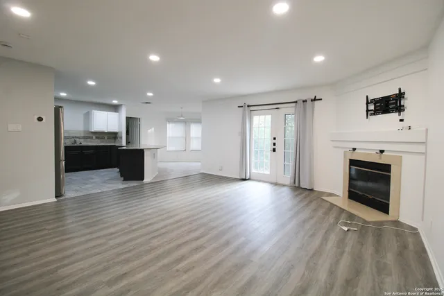 a view of a kitchen with a sink and a stove top oven