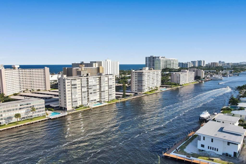 303 North Riverside Drive, Unit PH4 Pompano Beach, FL 33062 - Photo 3 of 52 a view of a terrace with wooden floor