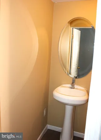 a bathroom with a sink and mirror