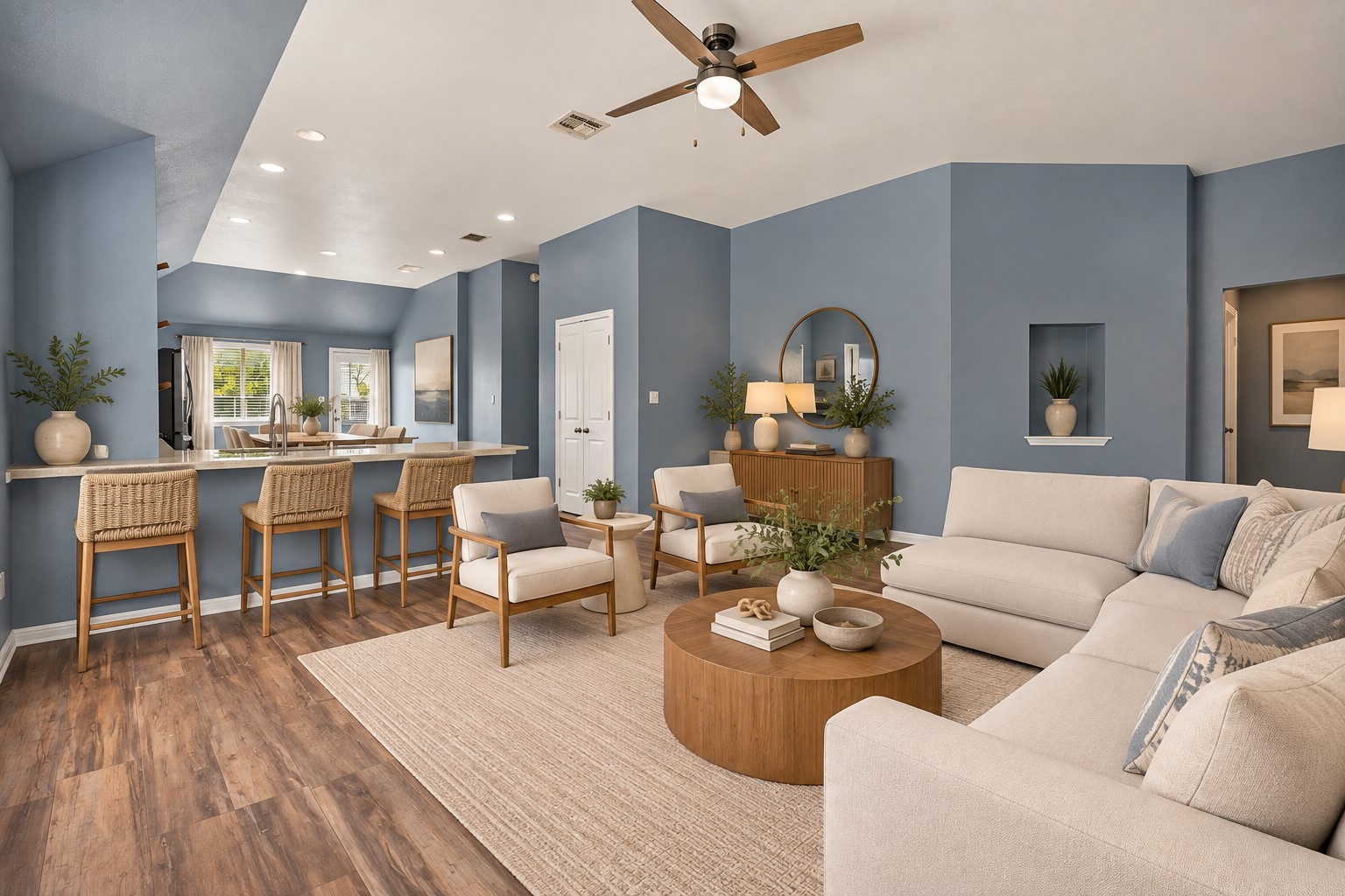 216 Spinnaker Loop Kyle, TX 78640 - Photo 4 of 23 Warm wood flooring and high ceilings define this inviting, open-concept living space.