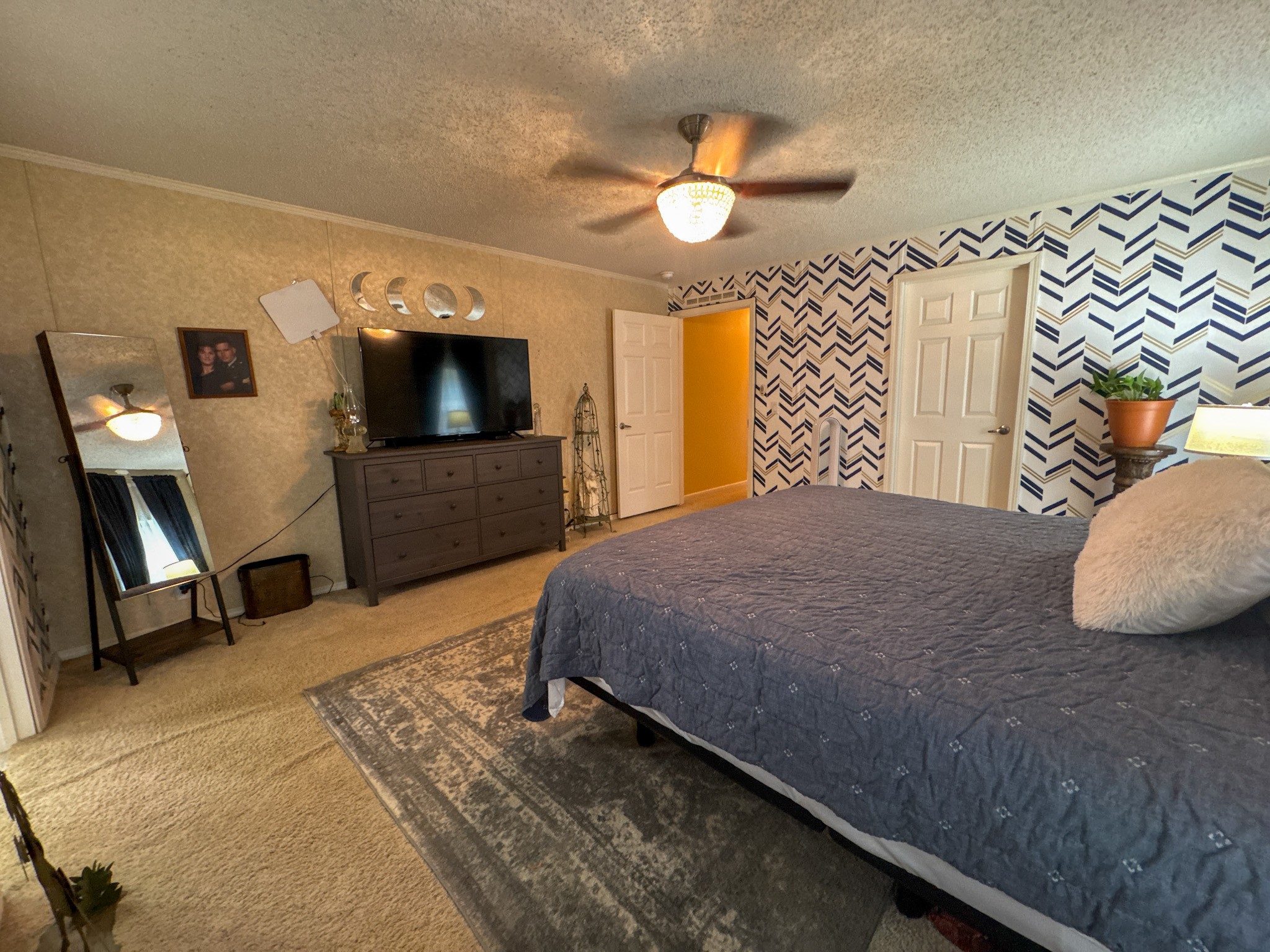 4791 Guys Chewalla Road Ramer, TN 38367 - Photo 15 of 77 a bedroom with a bed and a chandelier