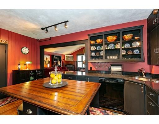 267 North Road Sudbury, MA 01776 - Photo 11 of 23 a kitchen with a stove a cabinets and a dining table