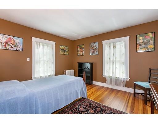 267 North Road Sudbury, MA 01776 - Photo 20 of 23 a bedroom with a bed and a table with chair