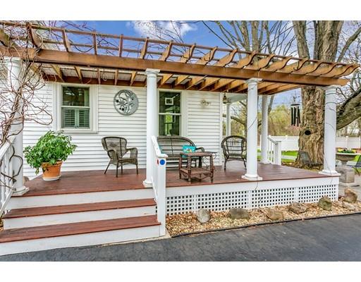267 North Road Sudbury, MA 01776 - Photo 2 of 23 a view of a porch with a table and chairs