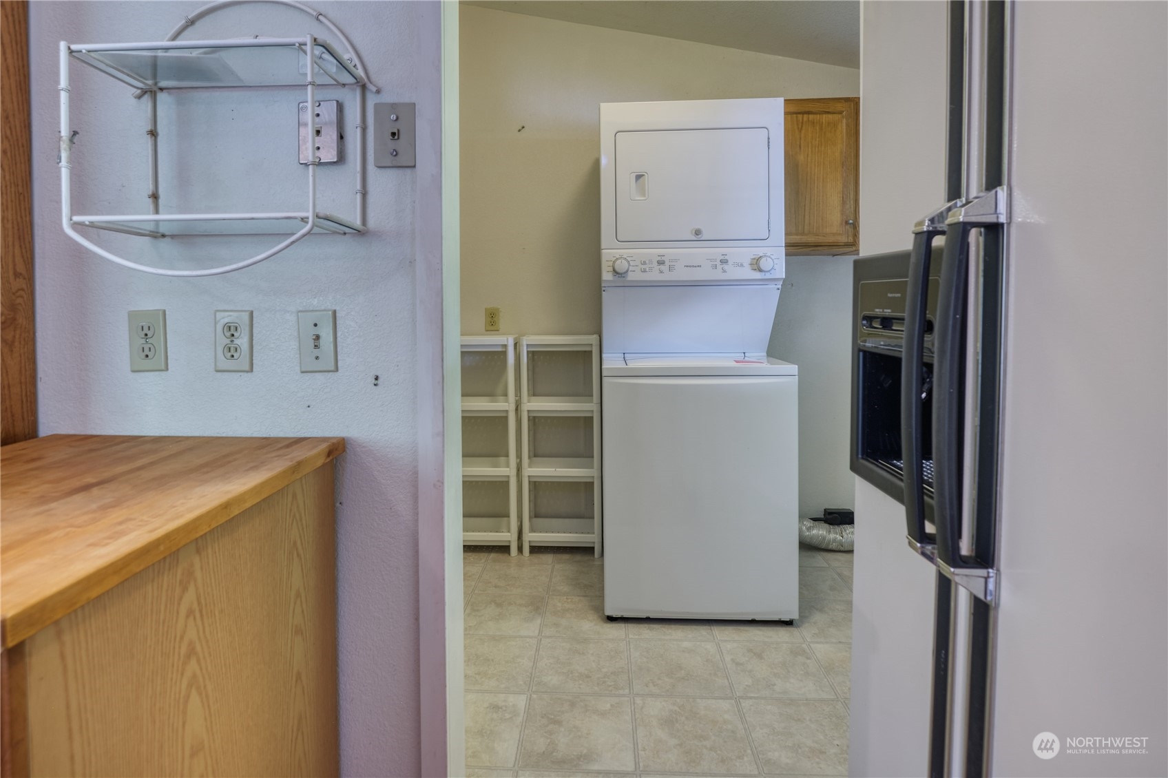 1721 Benson Road, Unit 119 Point Roberts, WA 98281 - Photo 14 of 24 a room with cabinets and a wooden floor