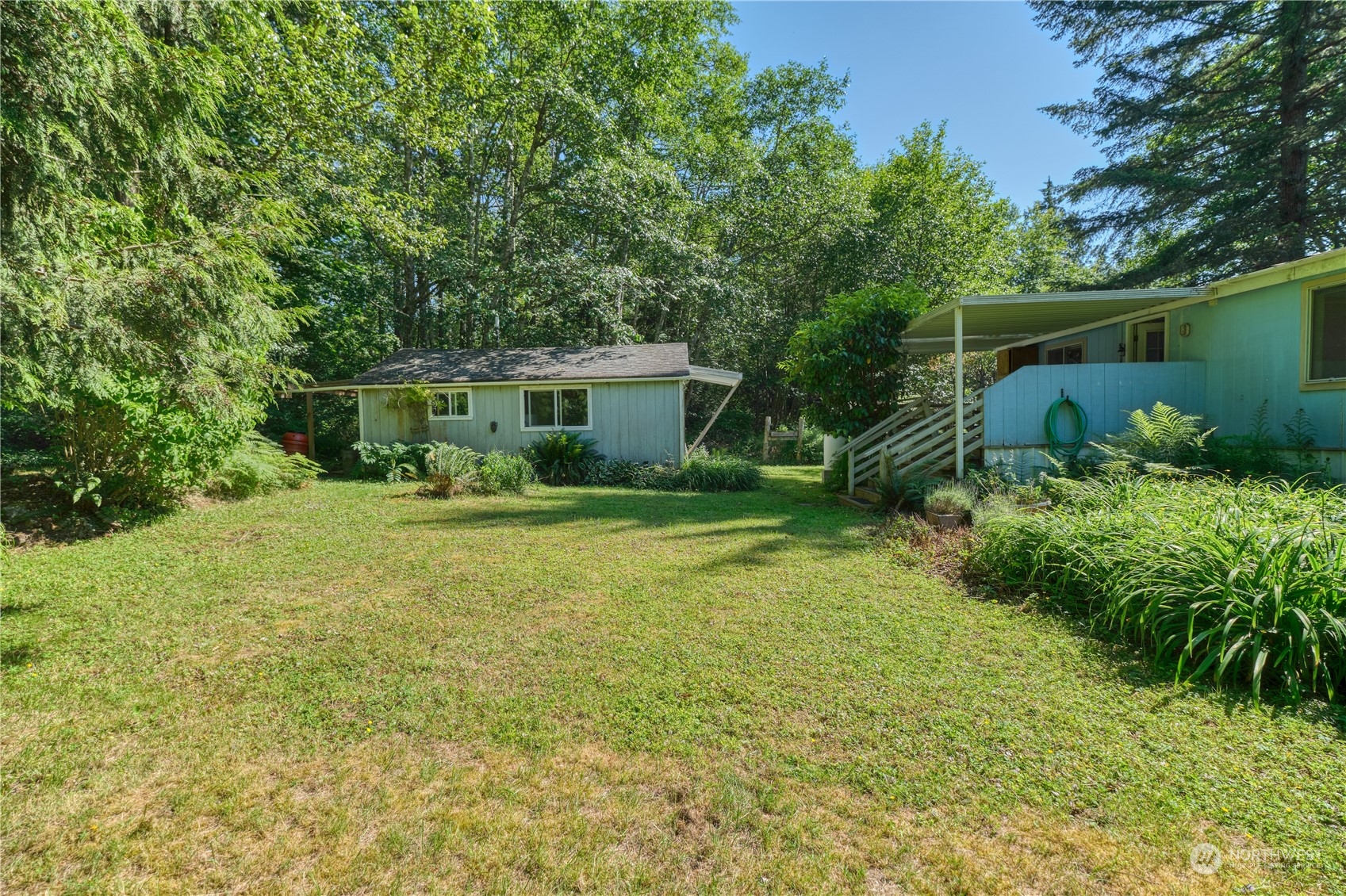 1721 Benson Road, Unit 119 Point Roberts, WA 98281 - Photo 22 of 24 a view of a house with a yard