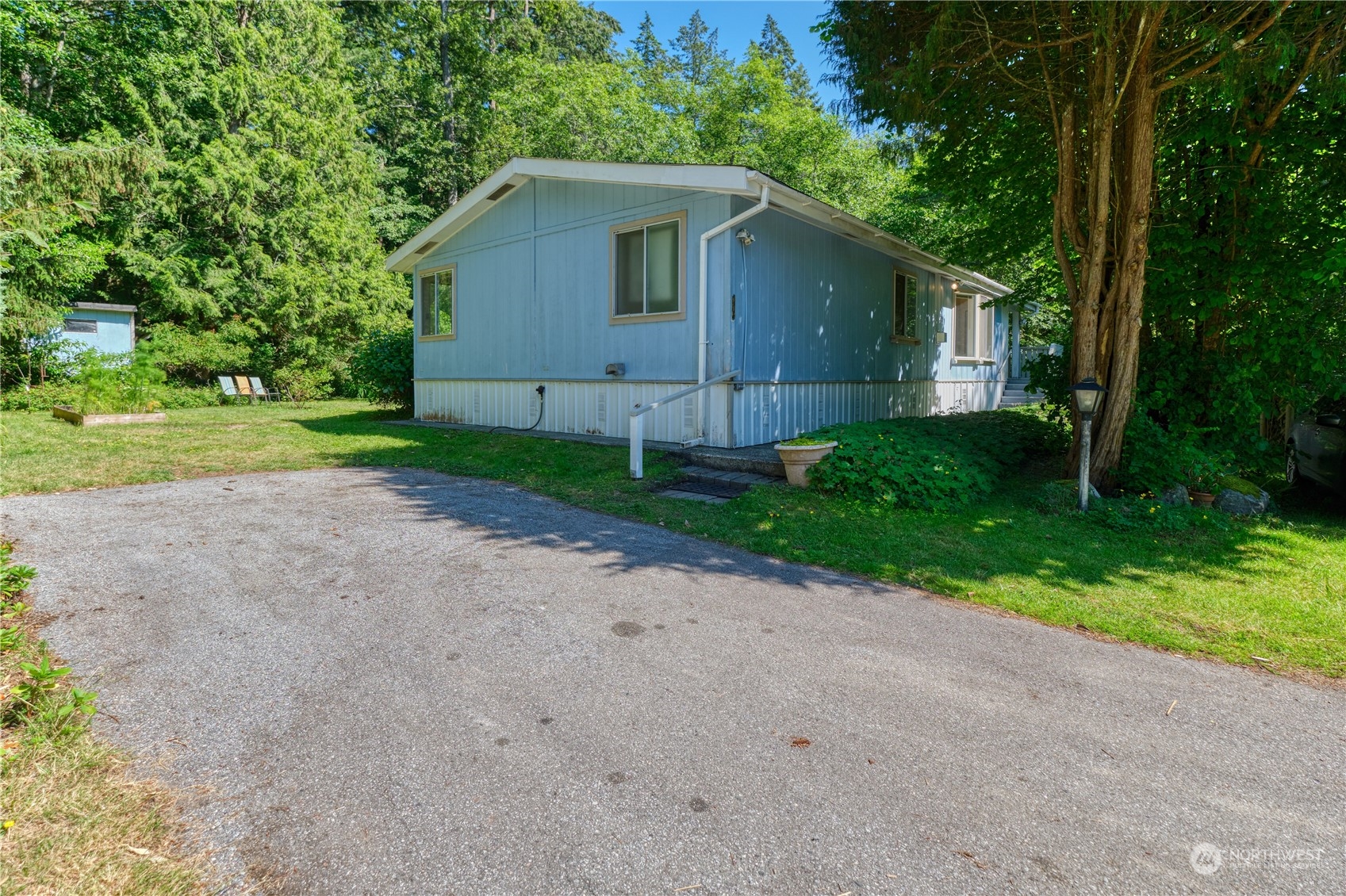 1721 Benson Road, Unit 119 Point Roberts, WA 98281 - Photo 24 of 24 a view of a house with yard and a garden