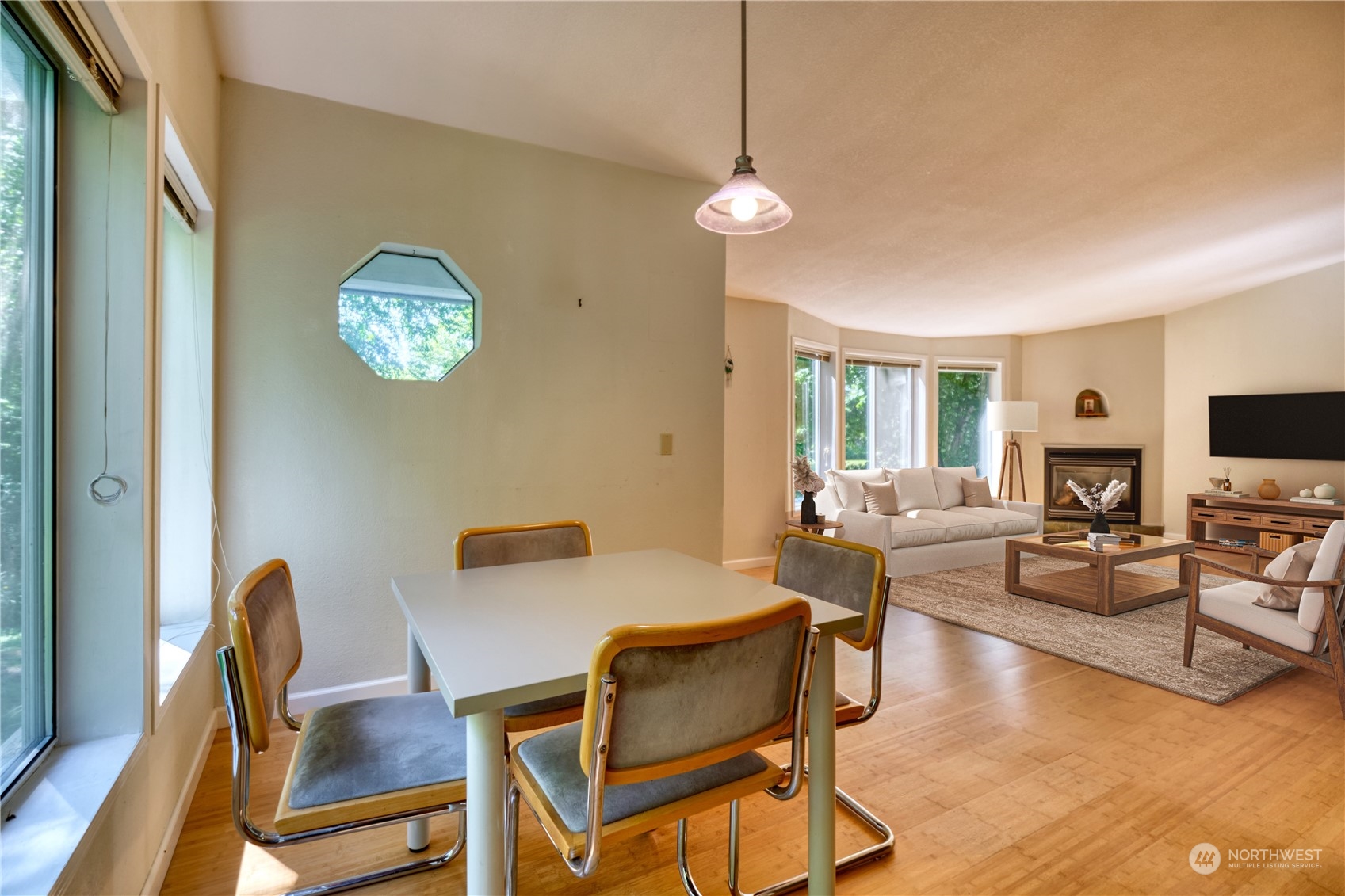 1721 Benson Road, Unit 119 Point Roberts, WA 98281 - Photo 4 of 24 a view of a dining room with furniture a rug and wooden floor