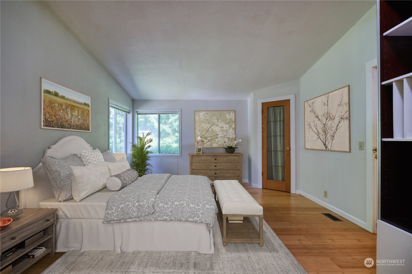 1721 Benson Road, Unit 119 Point Roberts, WA 98281 - Photo 7 of 24 a spacious bedroom with a large bed and a couch