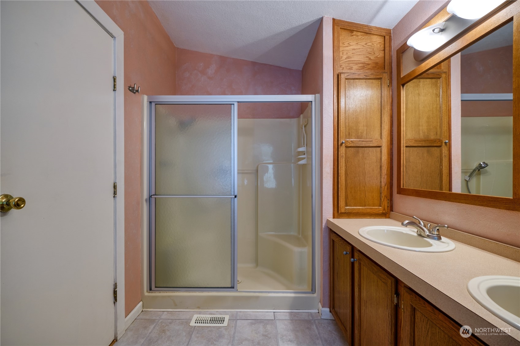 1721 Benson Road, Unit 119 Point Roberts, WA 98281 - Photo 10 of 24 a bathroom with a shower sink and mirror