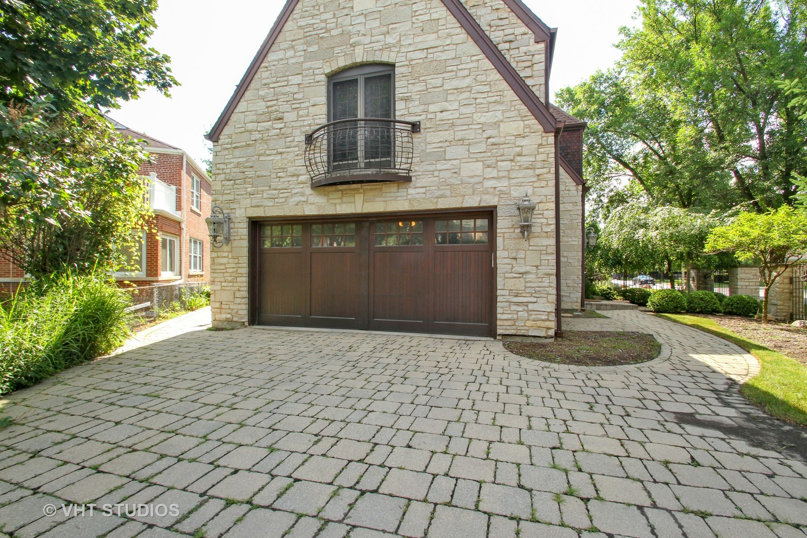 5900 North Kilpatrick Avenue Chicago, IL 60646 - Photo 19 of 21 a front view of a house with a yard and a garage