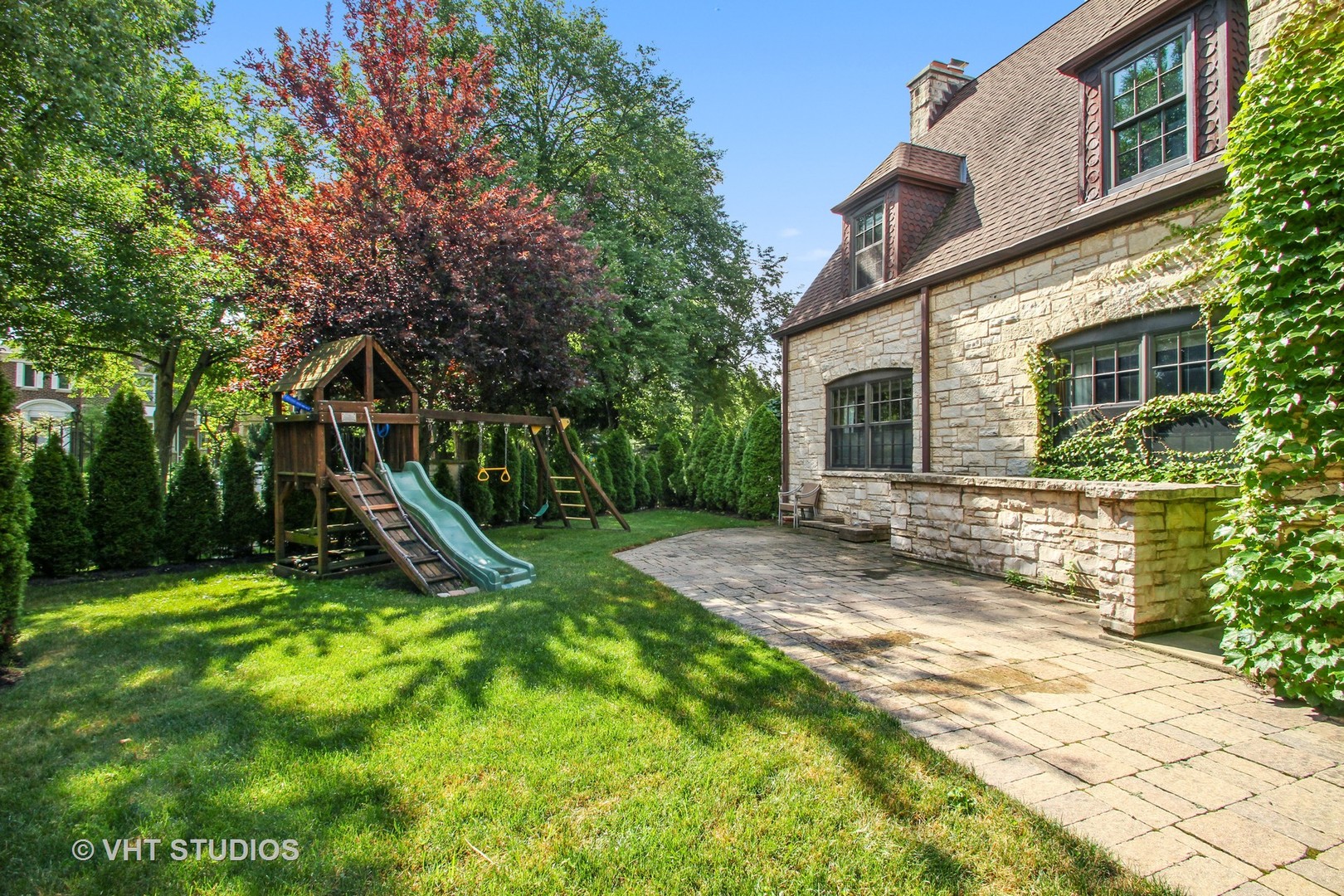 5900 North Kilpatrick Avenue Chicago, IL 60646 - Photo 20 of 21 a view of a house with a yard and sitting area