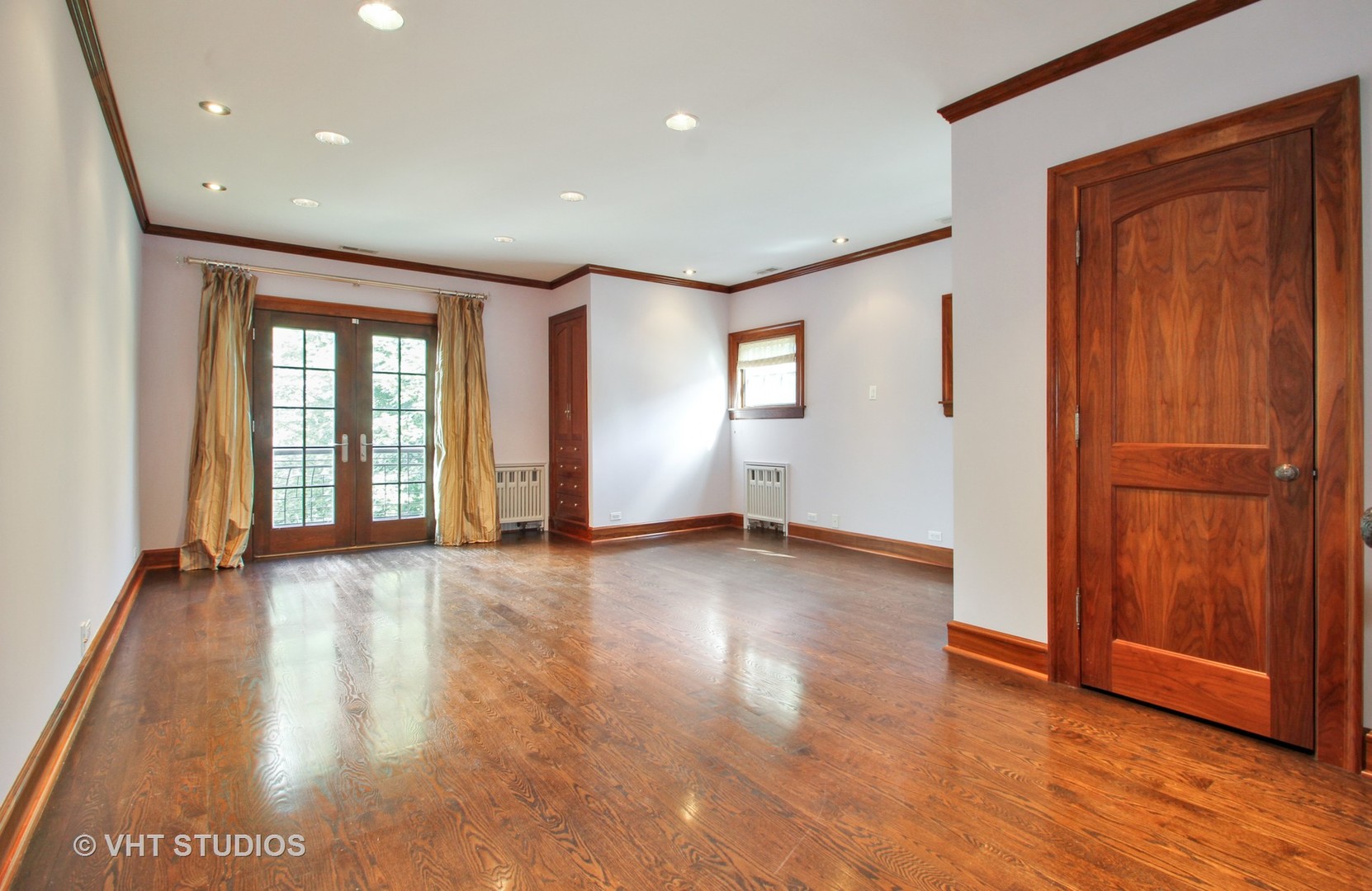 5900 North Kilpatrick Avenue Chicago, IL 60646 - Photo 7 of 21 an empty room with wooden floor and windows