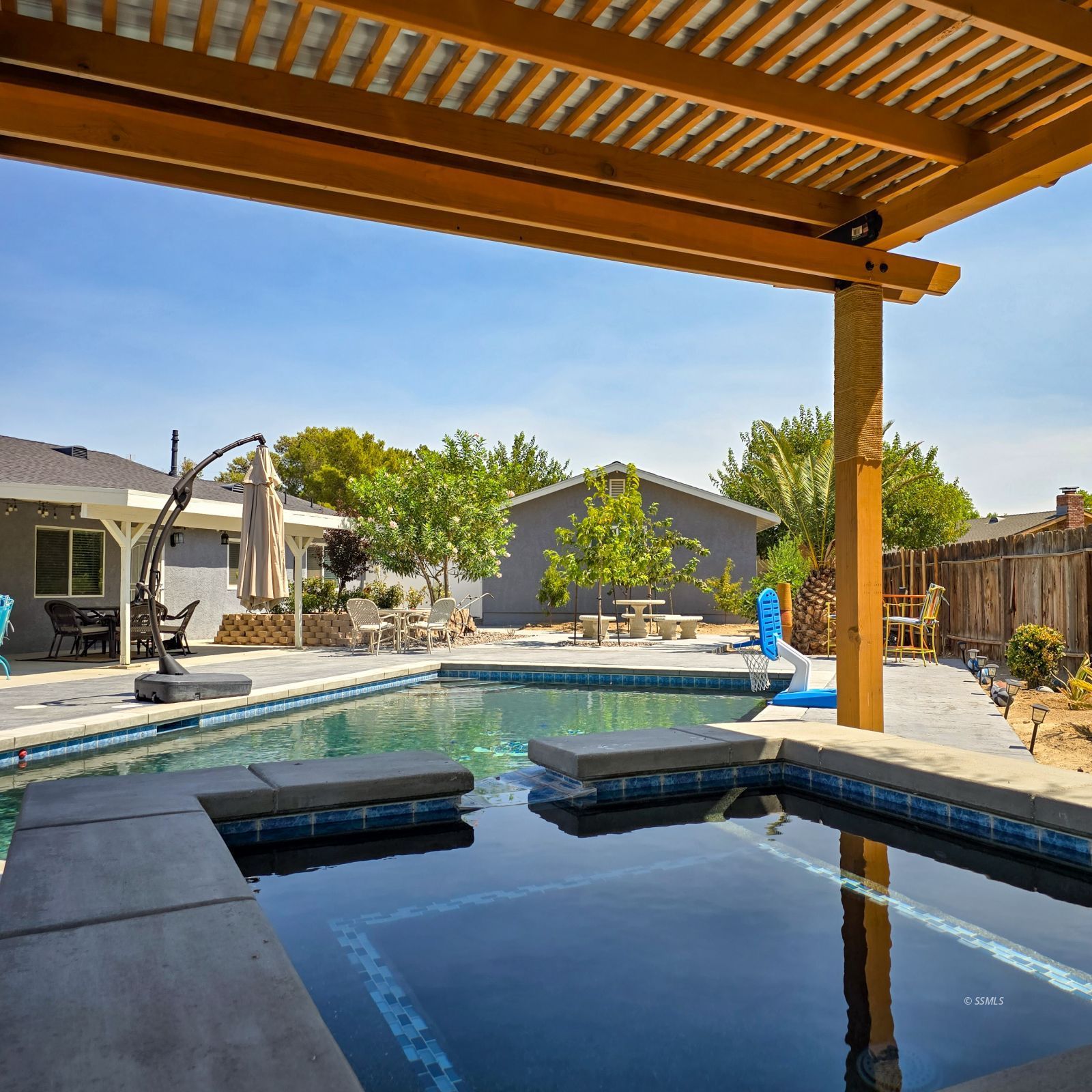 316 South Lilac Street Ridgecrest, CA 93555 - Photo 31 of 45 a view of swimming pool with outdoor seating and a patio
