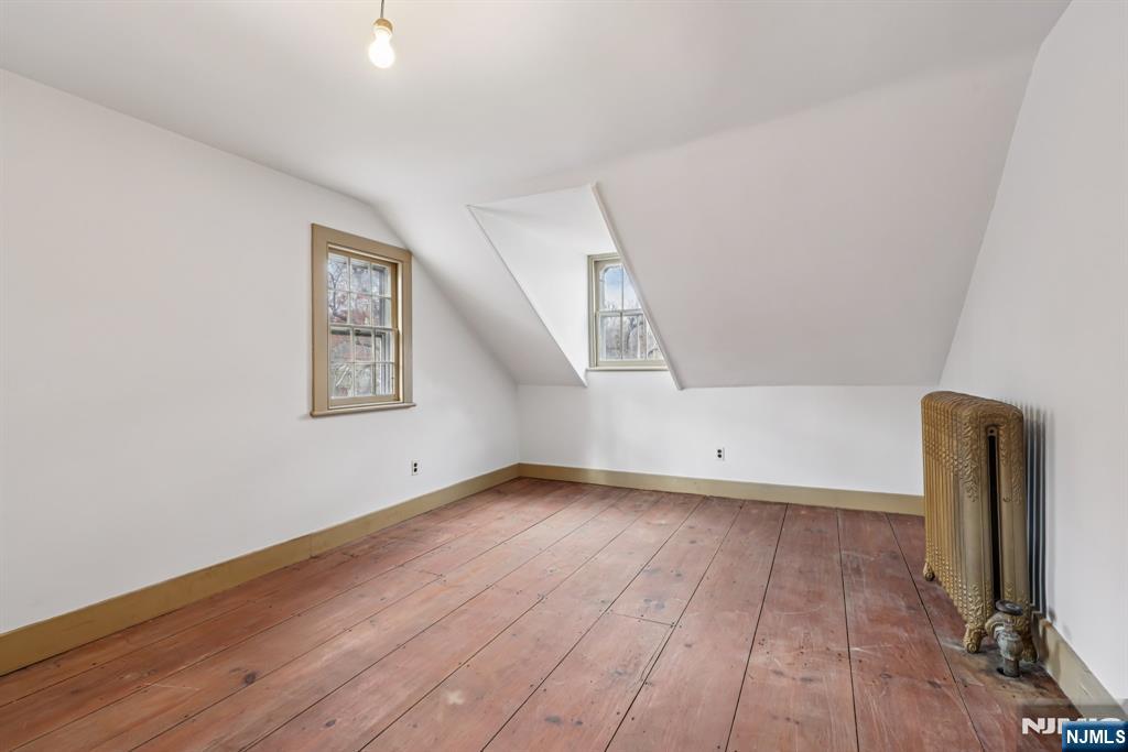142 Island Road Mahwah, NJ 07430 - Photo 36 of 46 a view of an empty room with wooden floor and a window