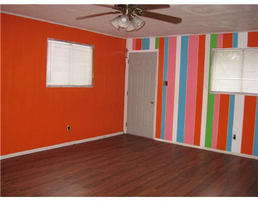 1345 Ray Drive Corpus Christi, TX 78411 - Photo 6 of 7 a view of a room with wooden floor and entryway