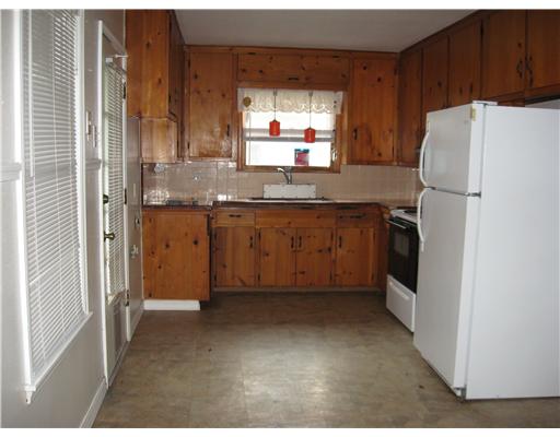 1345 Ray Drive Corpus Christi, TX 78411 - Photo 7 of 7 a kitchen with a refrigerator sink and cabinets