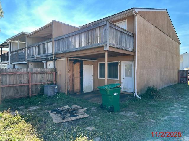 145 4th Avenue, Unit E4 Shalimar, FL 32579 - Photo 16 of 24 a front view of a house with garden