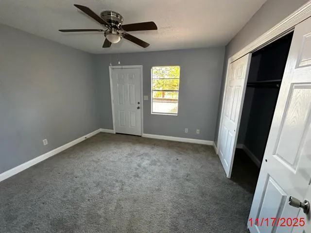 a view of a pathway with a backyard