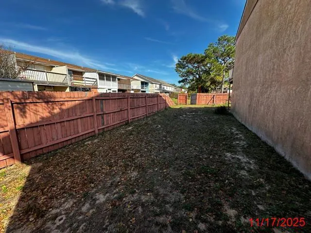 an aerial view of a residential apartment building with a yard