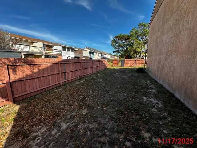 145 4th Avenue, Unit E4 Shalimar, FL 32579 - Photo 22 of 24 a view of a backyard with pathway