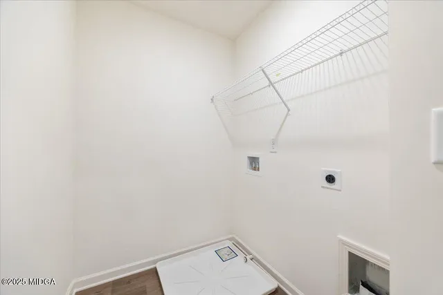 a bathroom with a granite countertop sink toilet and mirror