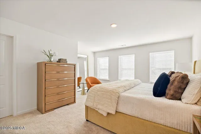 a bedroom with a bed and furniture