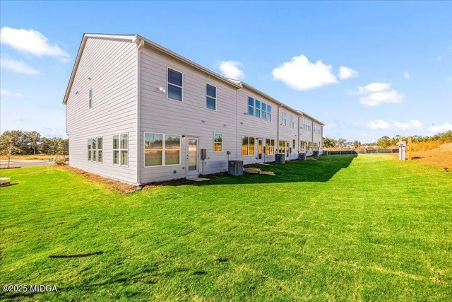 a view of house with yard
