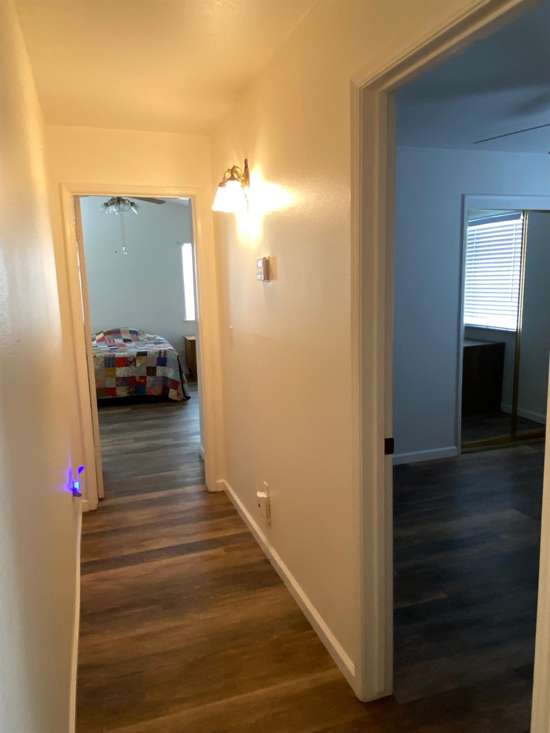 609 Merlot Avenue Madera, CA 93637 - Photo 31 of 45 a view of a hallway with wooden floor and staircase