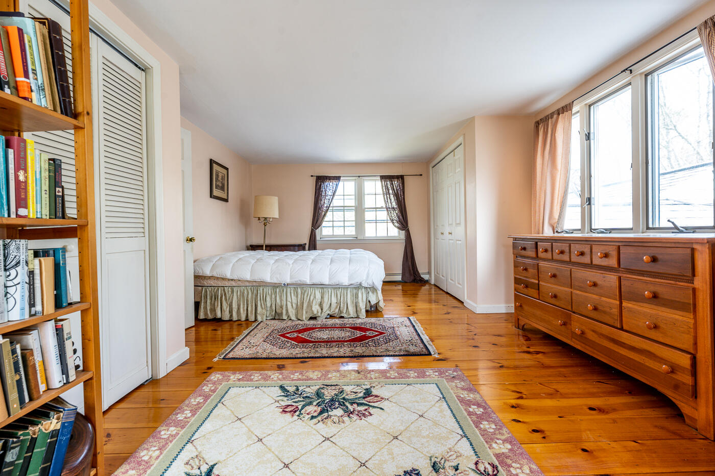 45 Sheffield Road Brewster, MA 02631 - Photo 11 of 25 a bedroom with a bed and a book shelf