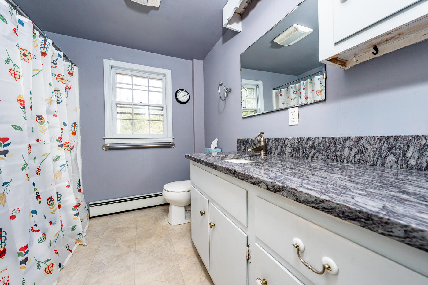 45 Sheffield Road Brewster, MA 02631 - Photo 15 of 25 a bathroom with a granite countertop sink a mirror and a toilet