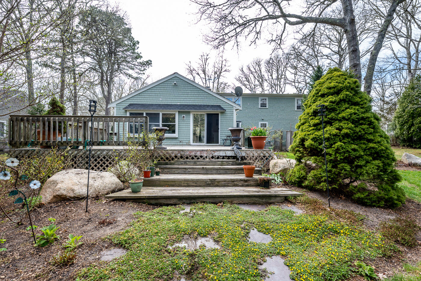 45 Sheffield Road Brewster, MA 02631 - Photo 24 of 25 a view of a house with backyard and sitting area