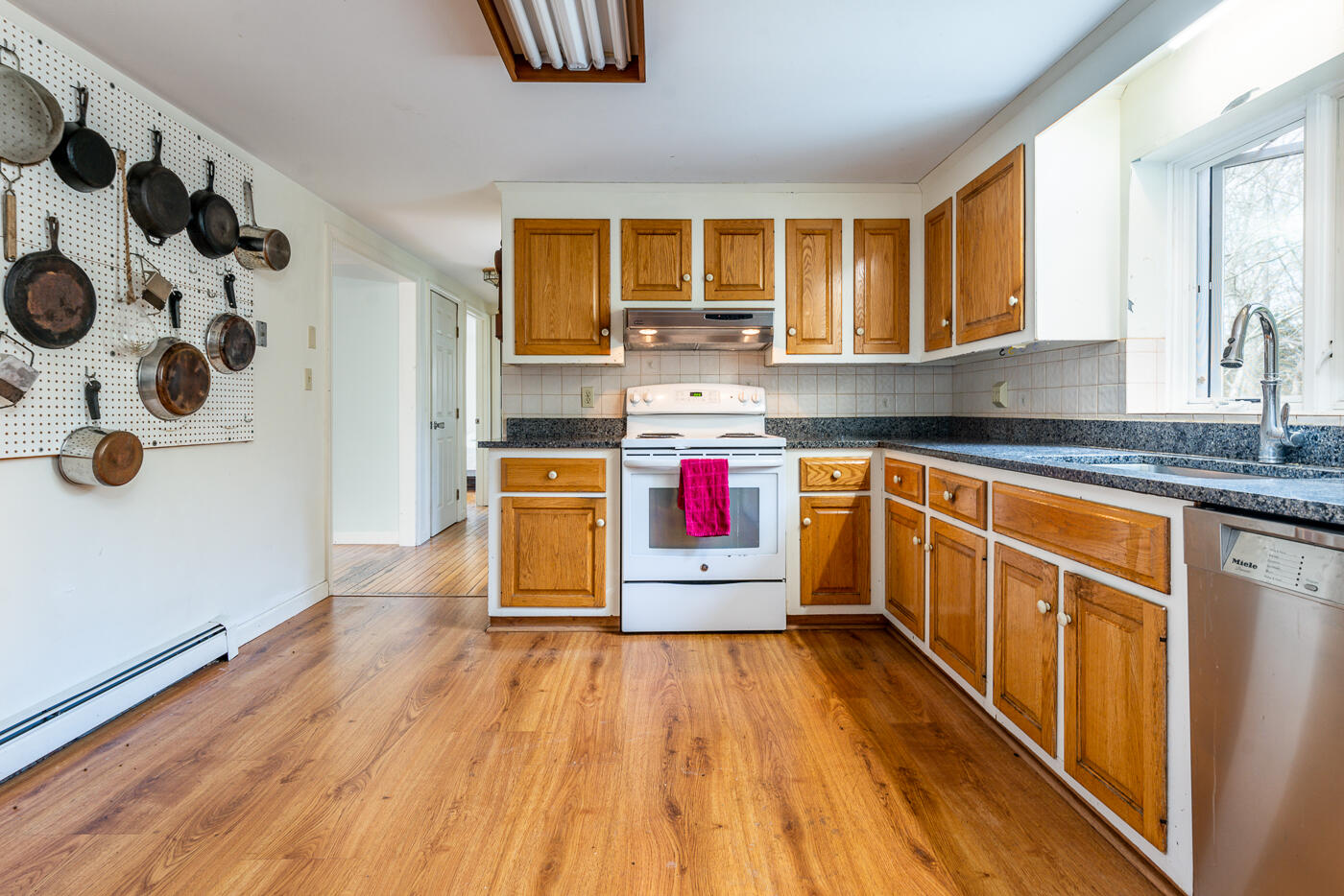 45 Sheffield Road Brewster, MA 02631 - Photo 5 of 25 a kitchen with stainless steel appliances granite countertop a stove and wooden cabinets