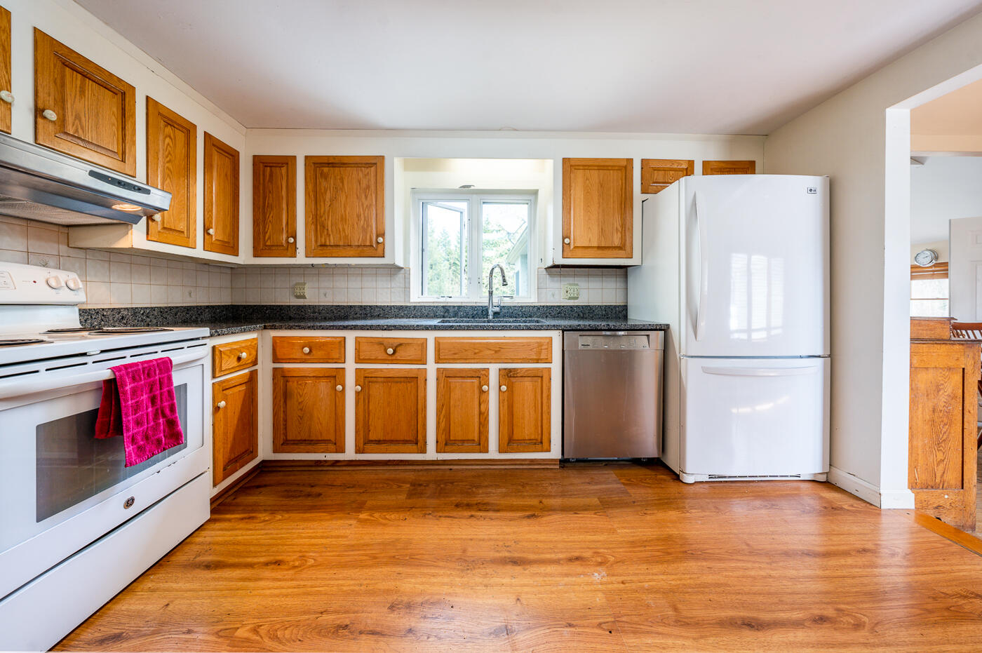 45 Sheffield Road Brewster, MA 02631 - Photo 6 of 25 a kitchen with stainless steel appliances granite countertop a refrigerator and a stove top oven