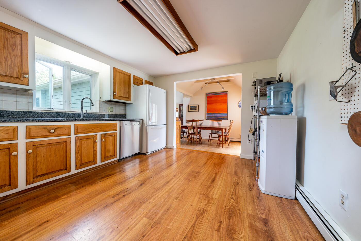 45 Sheffield Road Brewster, MA 02631 - Photo 7 of 25 a kitchen with stainless steel appliances granite countertop a refrigerator a stove and a wooden floors