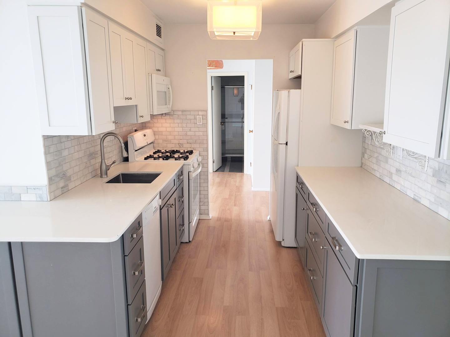 40 North Tower Road, Unit 5B Oak Brook, IL 60523 - Photo 5 of 25 a kitchen with a sink stove top oven and refrigerator