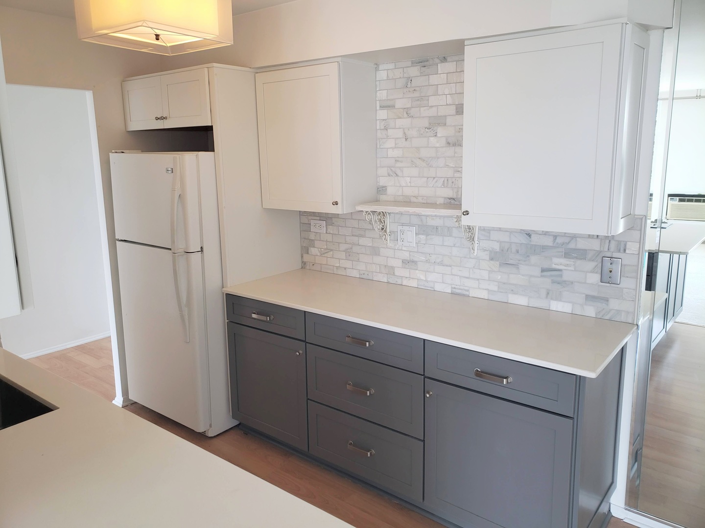 40 North Tower Road, Unit 5B Oak Brook, IL 60523 - Photo 7 of 25 a kitchen with a sink a refrigerator and cabinets