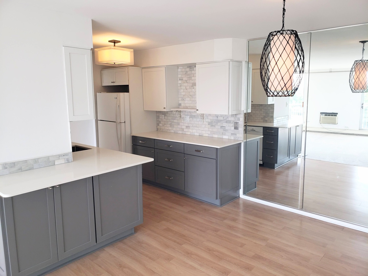 40 North Tower Road, Unit 5B Oak Brook, IL 60523 - Photo 8 of 25 a kitchen with stainless steel appliances granite countertop a sink a stove and a wooden floors