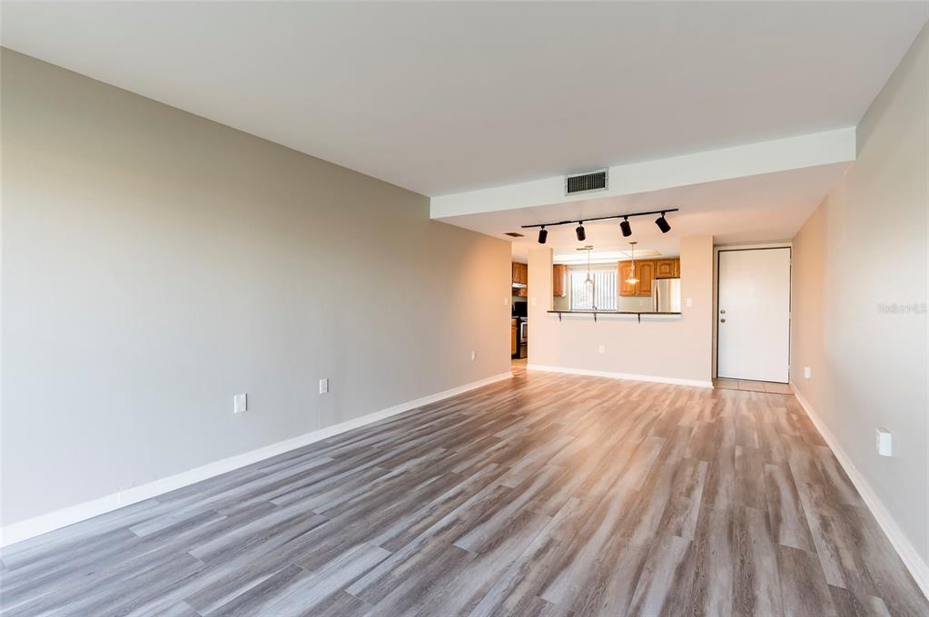 735 South Village Drive, Unit 206 St. Petersburg, FL 33716 - Photo 18 of 45 a view of empty room with wooden floor